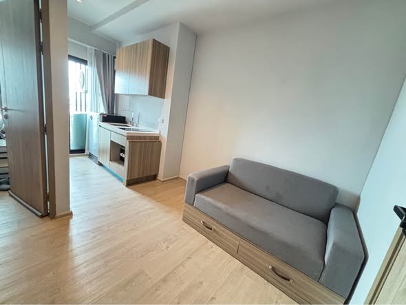 bedroom and living room of Altitude Unicorn Sathorn