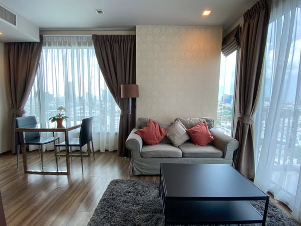 bedroom and living room of CEIL By Sansiri