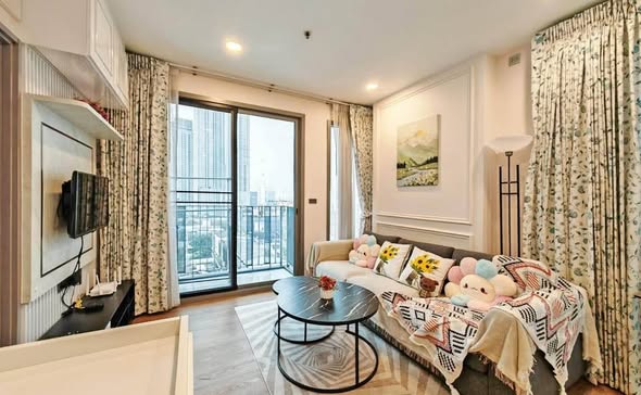 bedroom and living room of CEIL By Sansiri