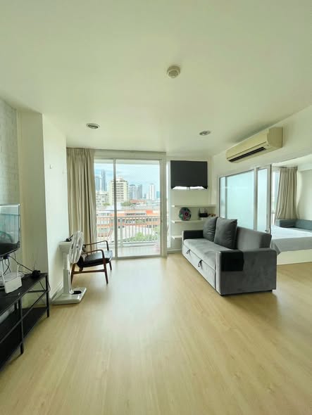 living room and bedroom of D65 Condominium