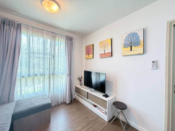 bedroom and living room of DCondo Nim