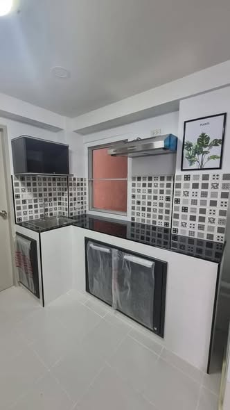 kitchen of ปาล์ม พาวิลเลี่ยน คอนโดมิเนียม