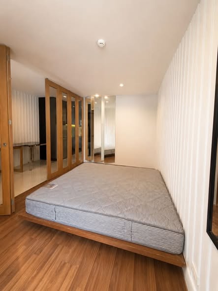 bedroom of L Style Condo