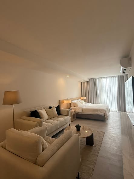 bedroom and living room of Malanan Modern Townhome