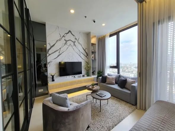 living room and bedroom of แมสซารีน รัชโยธิน | Mazarine Ratchayothin by Grand Unity
