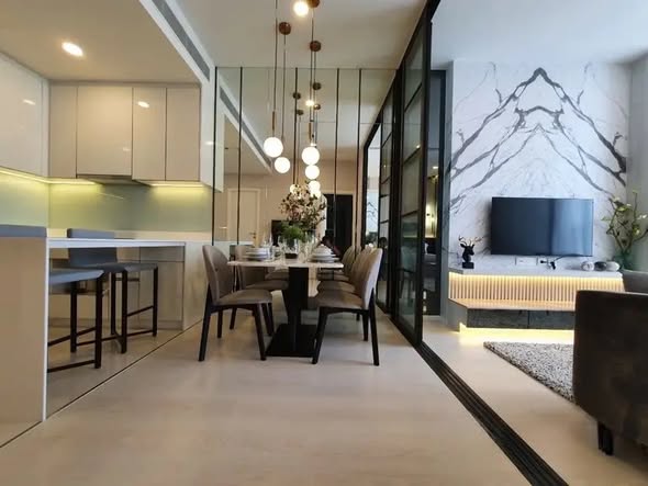 living room and kitchen of แมสซารีน รัชโยธิน | Mazarine Ratchayothin by Grand Unity