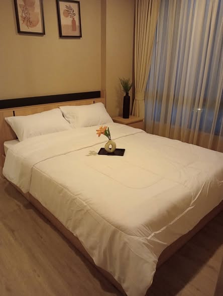 bedroom of Metro Luxe Riverfront Rattanathibet