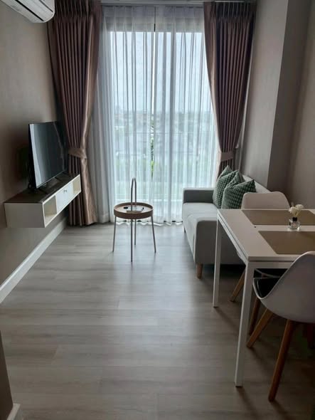 living room and bedroom of Metro Luxe Riverfront Rattanathibet