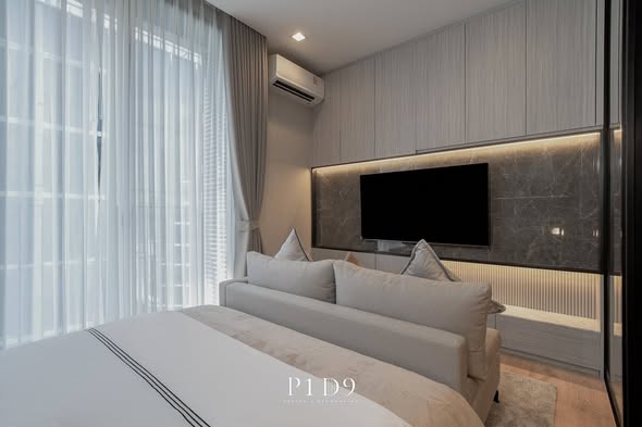 bedroom and living room of Noble Around Ari