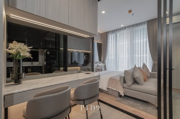 living room and bedroom of Noble Around Ari
