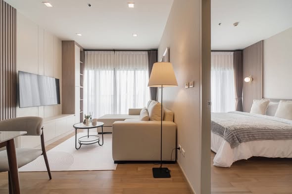 bedroom and living room of Noble Reveal