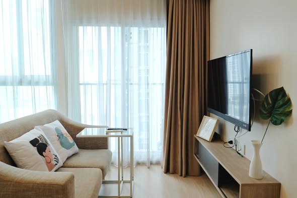 bedroom and living room of Noble Revolve Ratchada 2