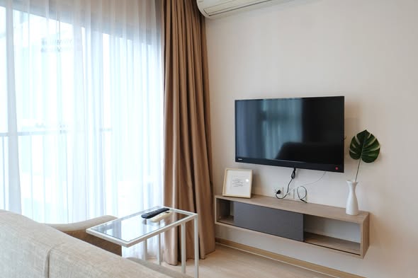 bedroom and living room of Noble Revolve Ratchada 2