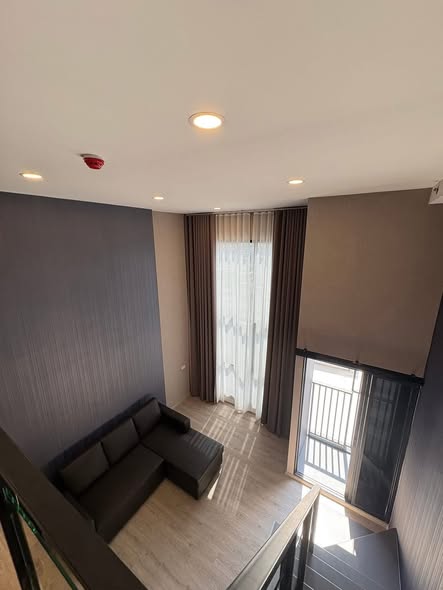 living room of Origin Plug & Play Sirindhorn Station