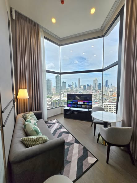 living room and bedroom of Park Origin Chula-Sam Yan