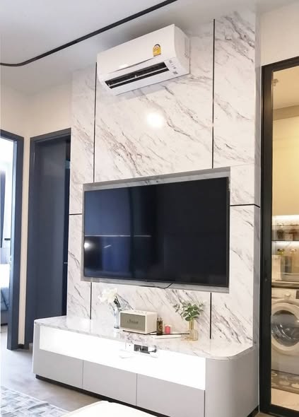 living room and kitchen of Park​ Origin​ Phaya Thai
