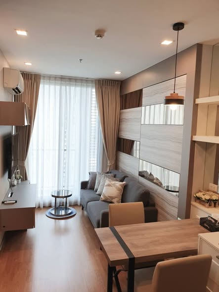 living room and bathroom of Q House Sukhumvit 79