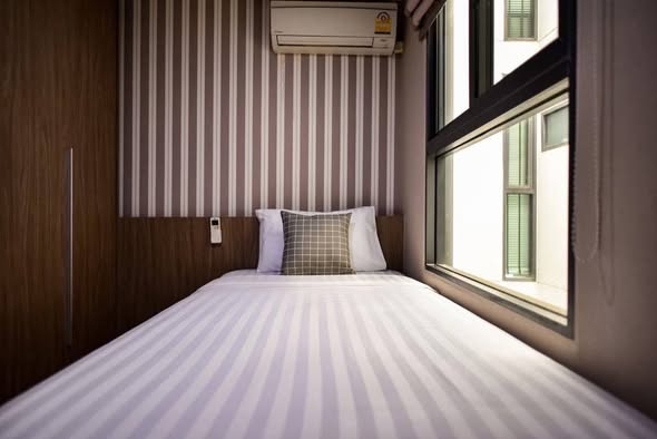 bedroom of Qube Suites Sukhumvit 46