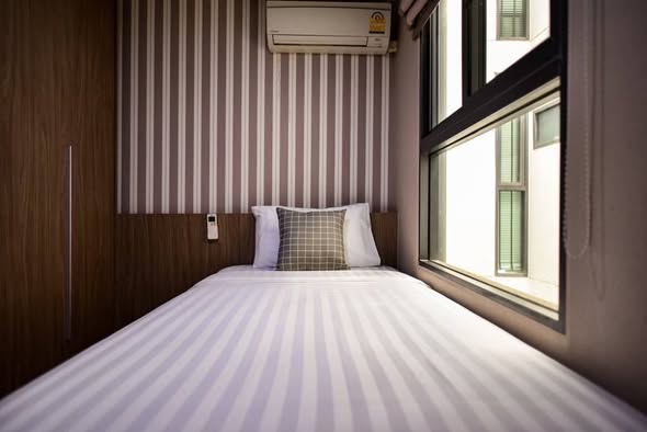 bedroom of Qube Suites Sukhumvit 46