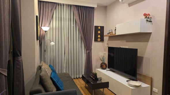 bedroom and living room of Stylish Condominium