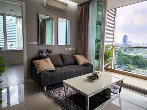 living room and bedroom of TC-Green Condominium