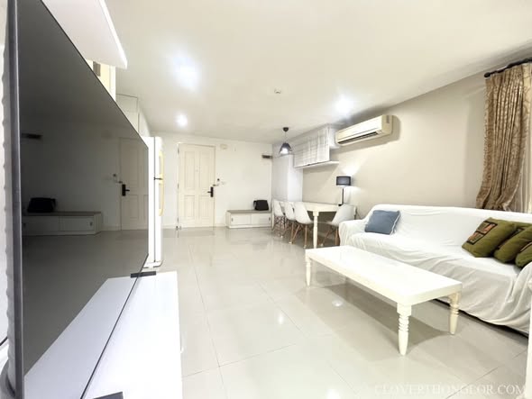 bedroom and living room of The Clover