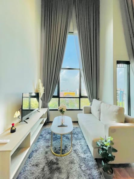 living room and bedroom of The Collect Ratchada 32