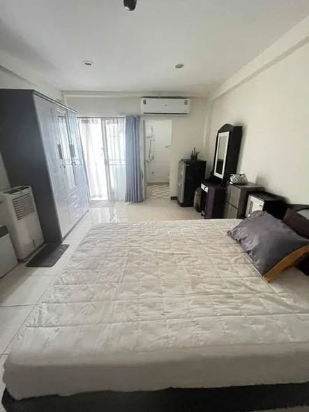 bedroom of The Color Living Hotel