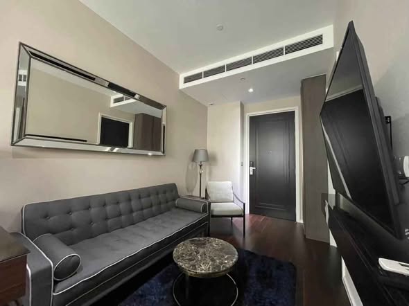 bedroom and living room of The Diplomat 39