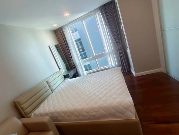 bedroom of The Metropolis Samrong