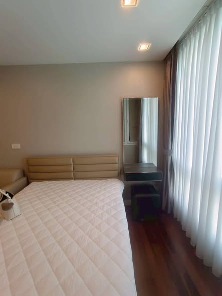 bedroom of The Metropolis Samrong