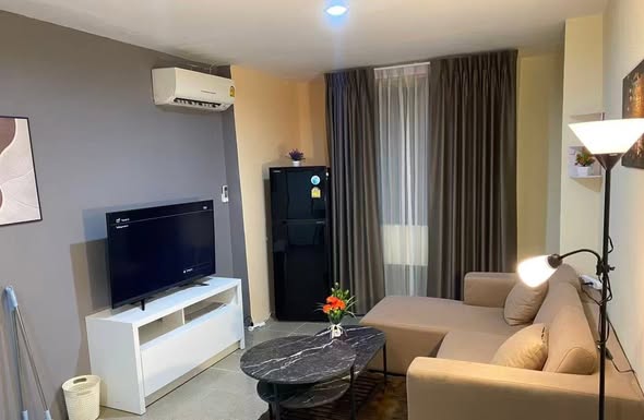 bedroom and living room of The Parkland Bangna