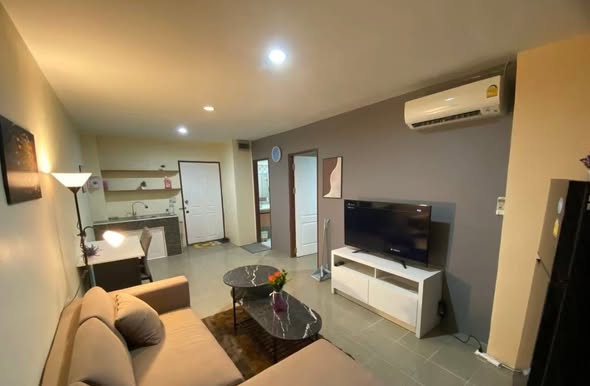 bedroom and living room of The Parkland Bangna
