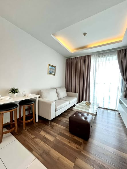 living room and bedroom of The Peak Towers