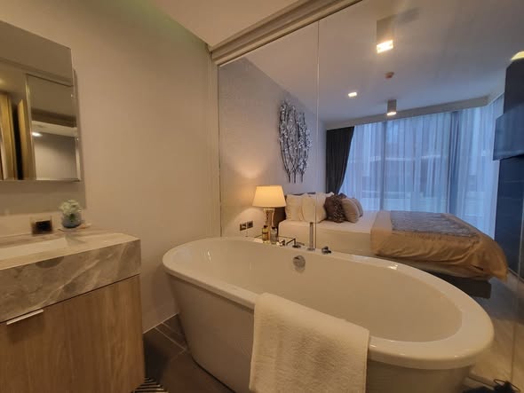 bedroom and bathroom of The Pine Hua Hin