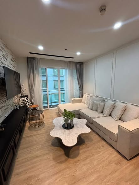 living room and bedroom of The Prime 11 Condo