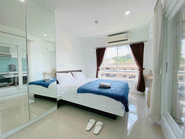 bedroom of The Scene Condo