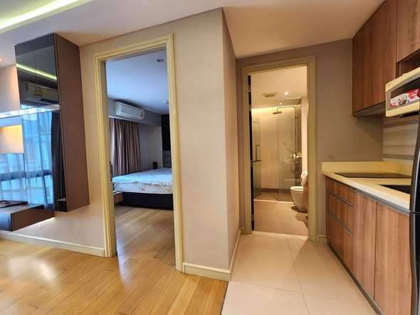 bedroom and room interior of Tidy Deluxe Condominium