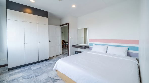 bedroom and room interior of T.I.T. Tower Apartment Service