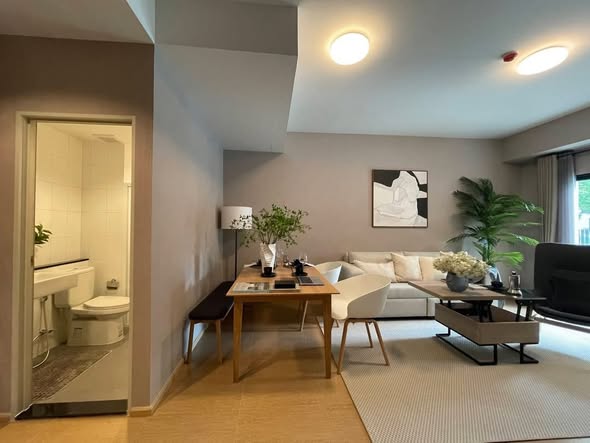 living room and bathroom of UNiO Sukhumvit 72