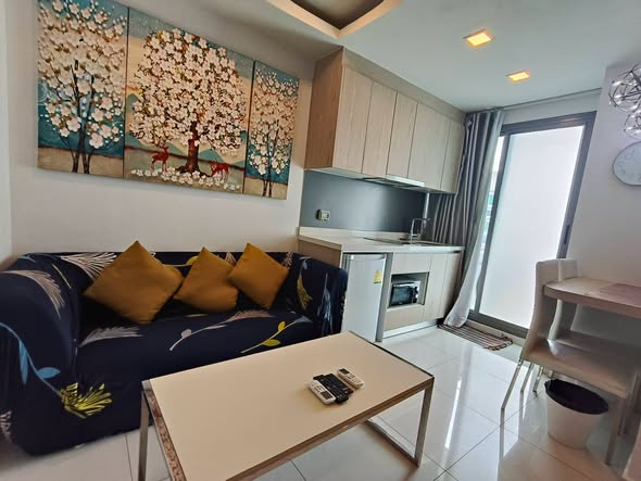 bedroom and living room of Arcadia Beach Resort Condominium