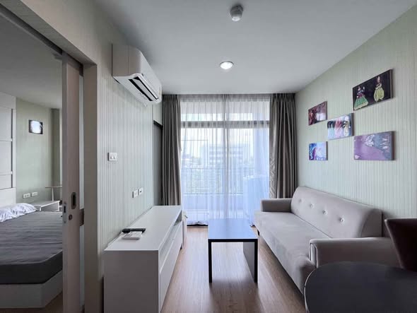 bedroom and living room of Baan Navatara Condominium