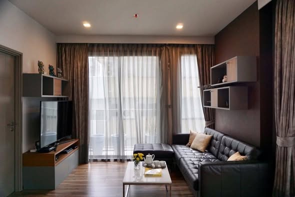 bedroom and living room of CEIL By Sansiri
