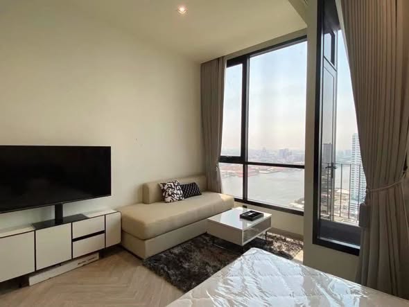 living room and bedroom of Chapter Charoenkrung-Riverside