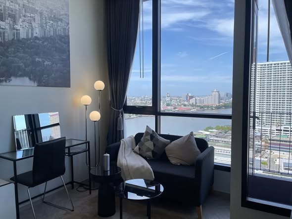 living room and bedroom of Chapter Charoennakhon–Riverside