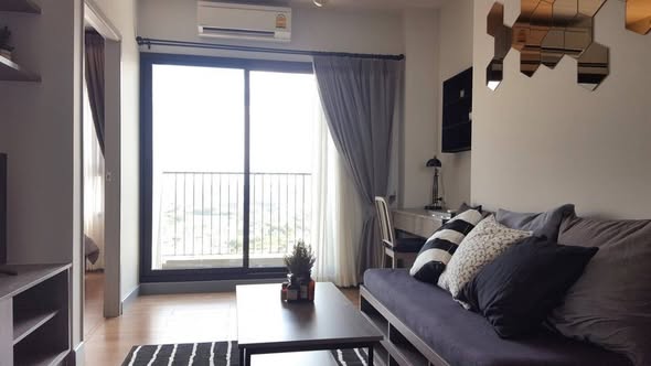 bedroom and living room of Chapter One Midtown Lat Phrao 24