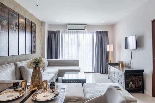 living room and bedroom of กลางกรุงรีสอร์ทคอนโด