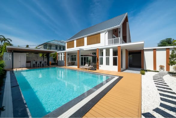 pool and room interior of LN Luxury Pool Villa – บ้านพักพูลวิลล่าชะอำ