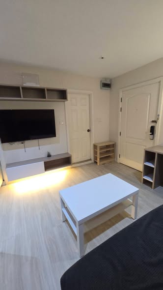 living room and bedroom of Lumpini Suite Sukhumvit 41