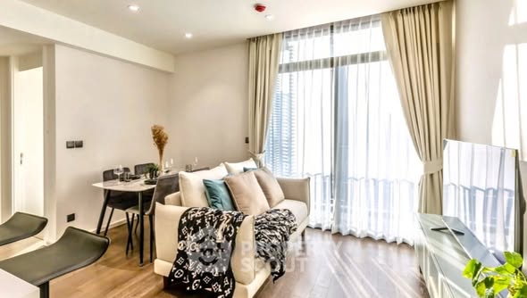 living room and bedroom of MUNIQ Sukhumvit 23